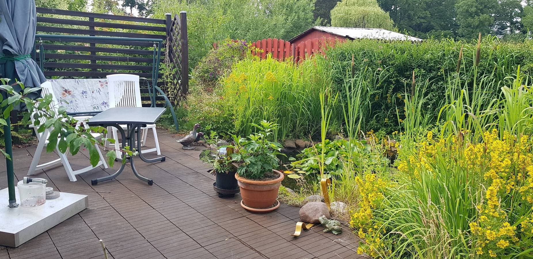 Foto 11 von 14: Bungalow 'Urgemütliches Am See' mit privater Terrasse und privatem Garten