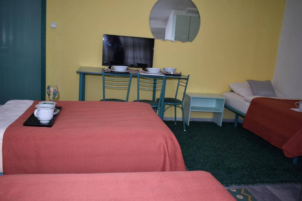 Foto 6 von 9: Triple Room with Private Bathroom