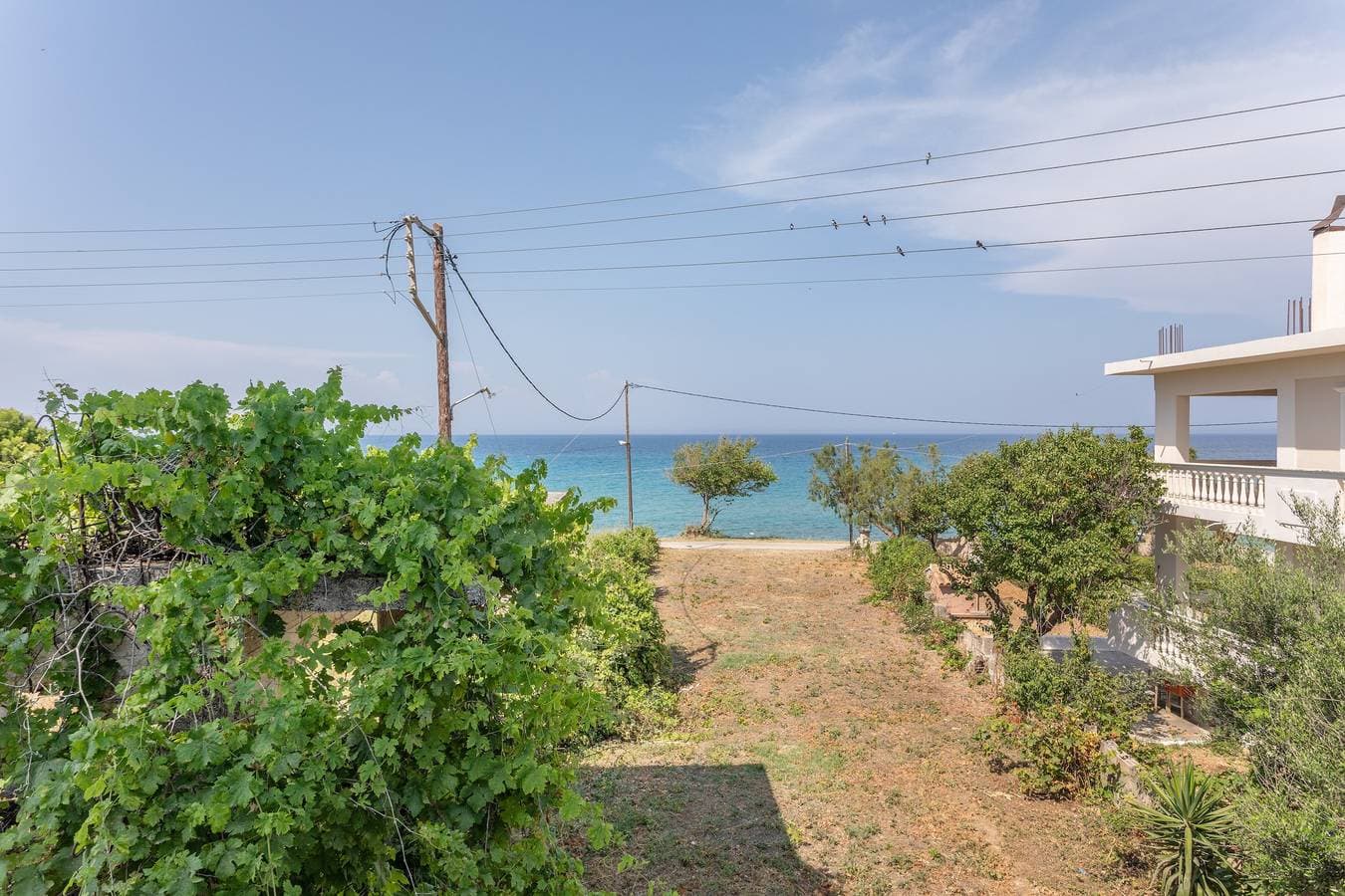 Foto 4 von 34: Ferienwohnung 'Bel Momento - Familienzimmer' mit Meerblick, Wi-Fi und Klimaanlage