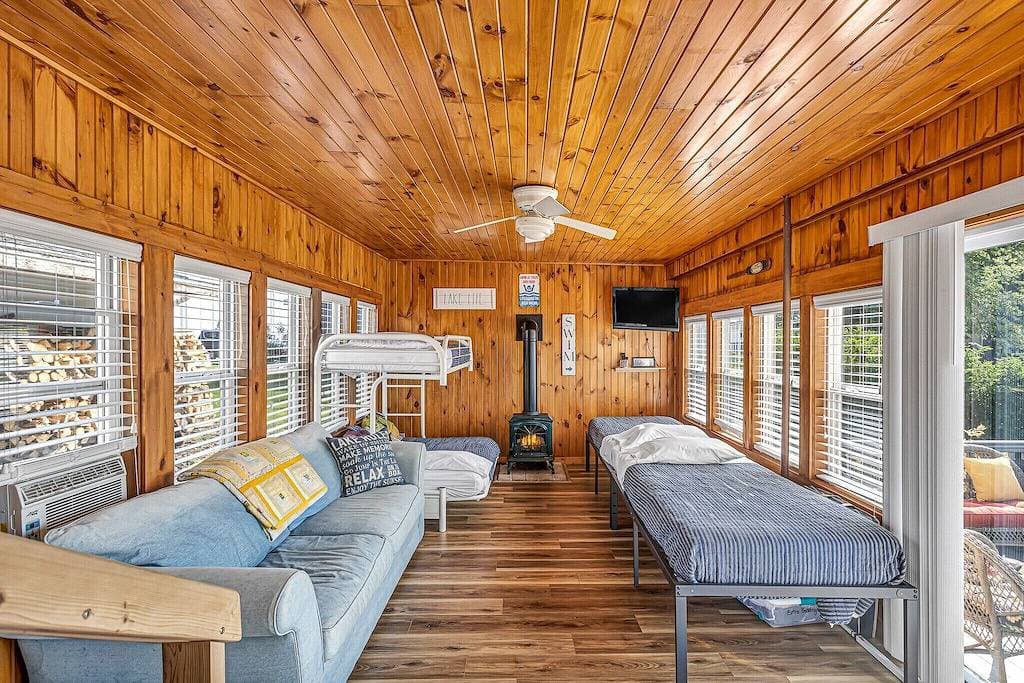 Lakefront Cottage with kayaks, paddleboat, aqua mat, & Big deck close to Elkhart 1