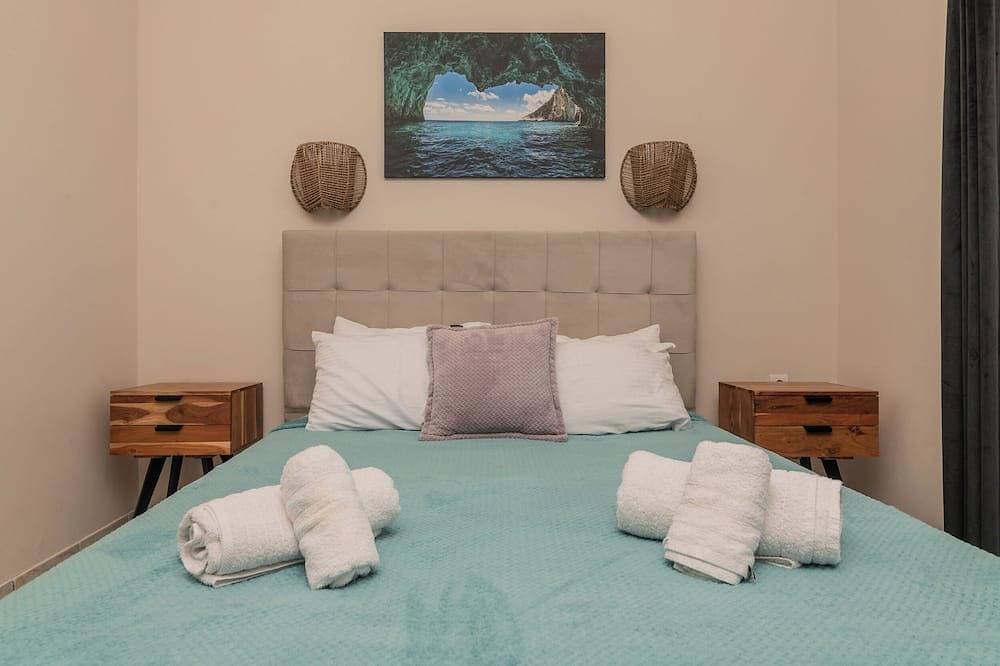 Foto 4 von 29: Tasos Villas - Nr. 2. Einzelvilla mit privatem, überdachtem Sitzbereich.