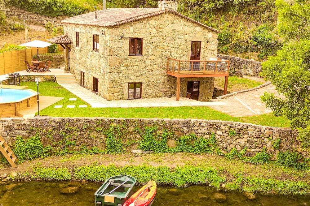 Foto 12 von 30: River House - Casas do Rio Tora