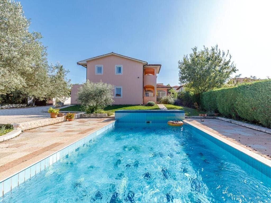 in the swimming pool Villa Brioni 2 1
