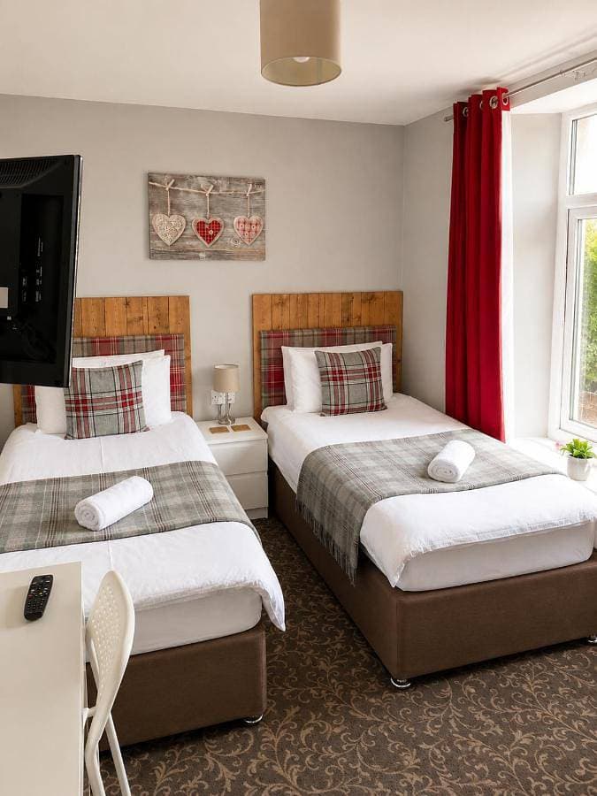 Foto 5 von 12: Triple Room with Private Bathroom