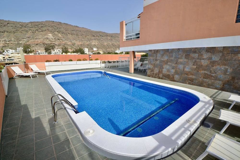 Foto 12 von 17: Apartment with communal swimming pool in Playa de Mogan - Paraiso
