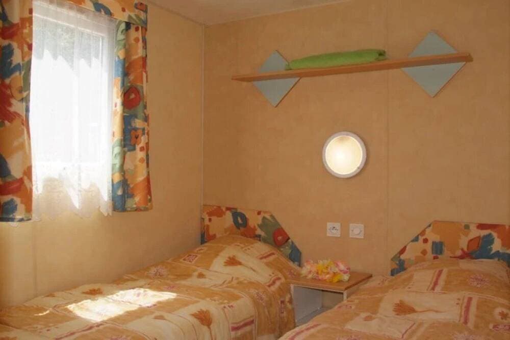 Foto 2 von 19: ZEcamping 3 étoiles  animations mobil-home TV clim 21m2 4 pers