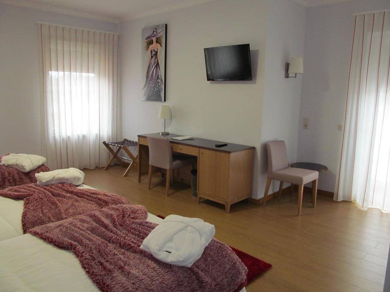 Foto 8 von 9: Triple Room with Balcony