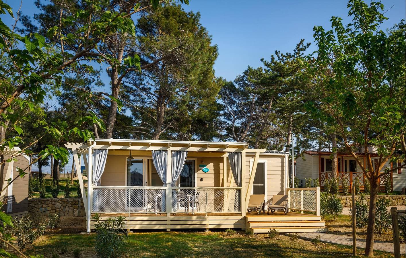 Foto 2 von 28: Gemütliches Mobilheim mit Pool, Terrasse und 1 km zum Strand