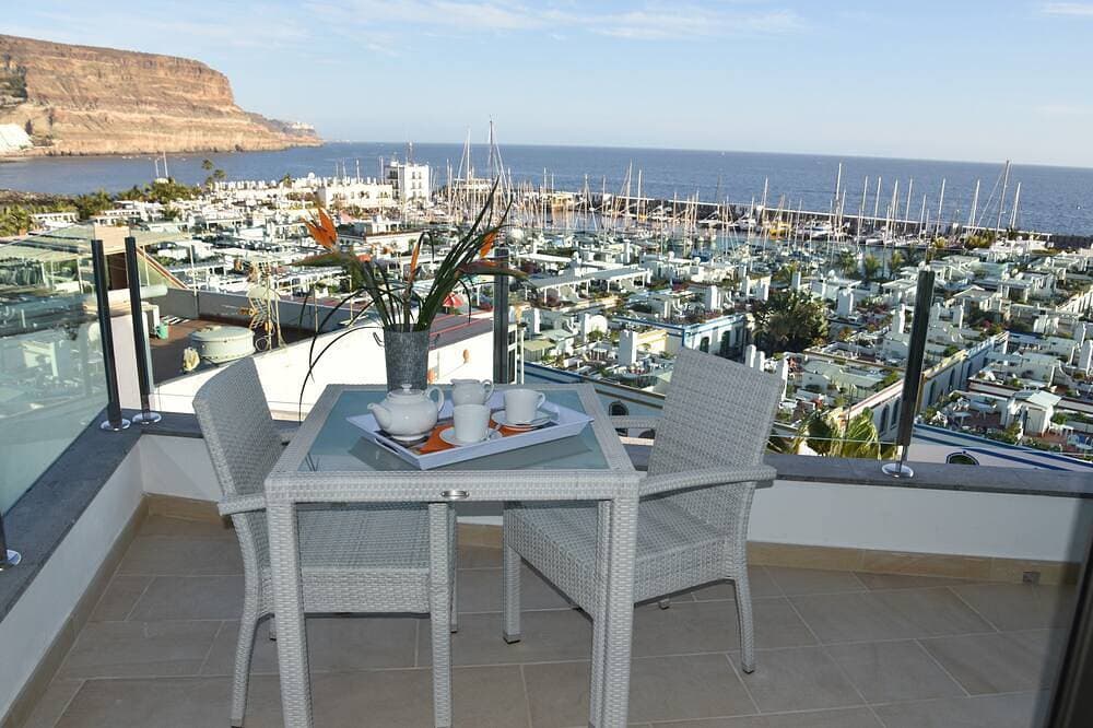 Foto 7 von 30: Apt. 1ºB \"Spectacular views of the sea and the marina of Puerto de Mogán\"
