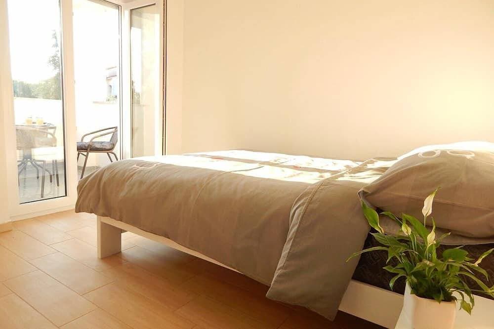 Foto 3 von 25: Comfortable holiday house with apartments / Beautiful first floor apartment with terrace and grill / A3