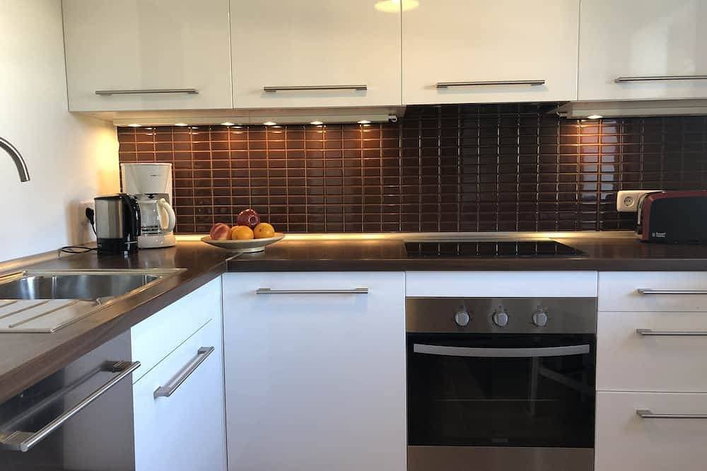 Foto 13 von 29: Ruhig gelegenes 4-Personen Ferienhaus mit Garten, Dachterrasse mit Meerblick