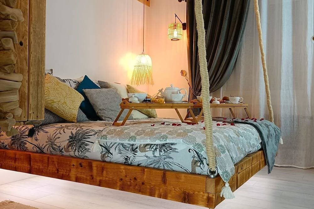 Foto 2 von 27: Cosy apartment with whirlpool bath in bedroom and catamaran net