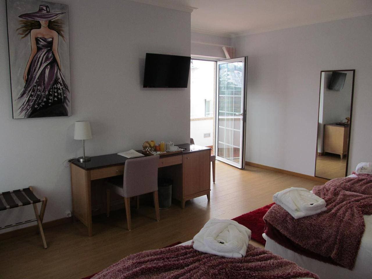 Foto 9 von 9: Triple Room with Balcony