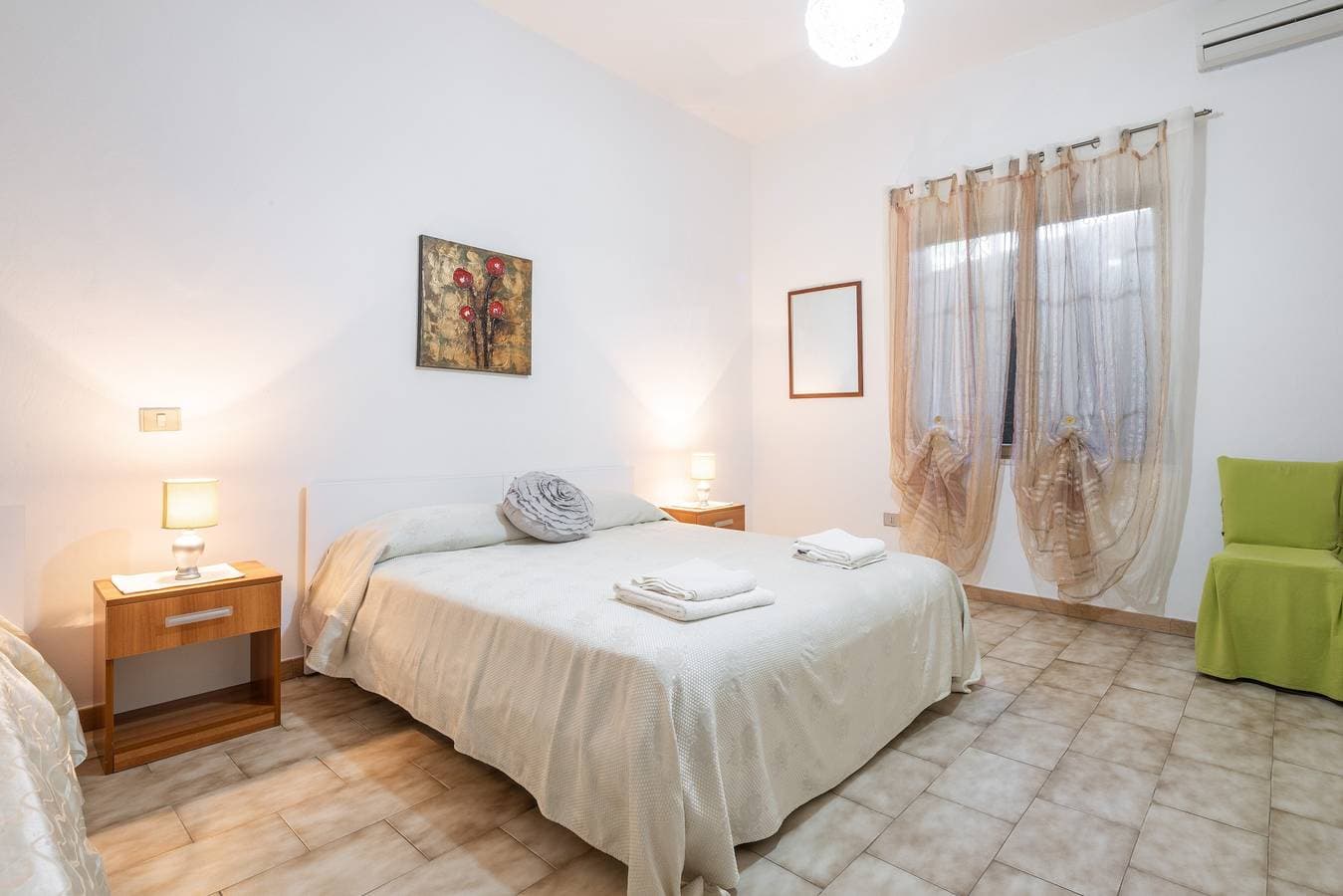 Foto 12 von 28: Ferienwohnung 'Gerani Rossi' mit Gemeinschaftsgarten, Wi-Fi und Klimaanlage