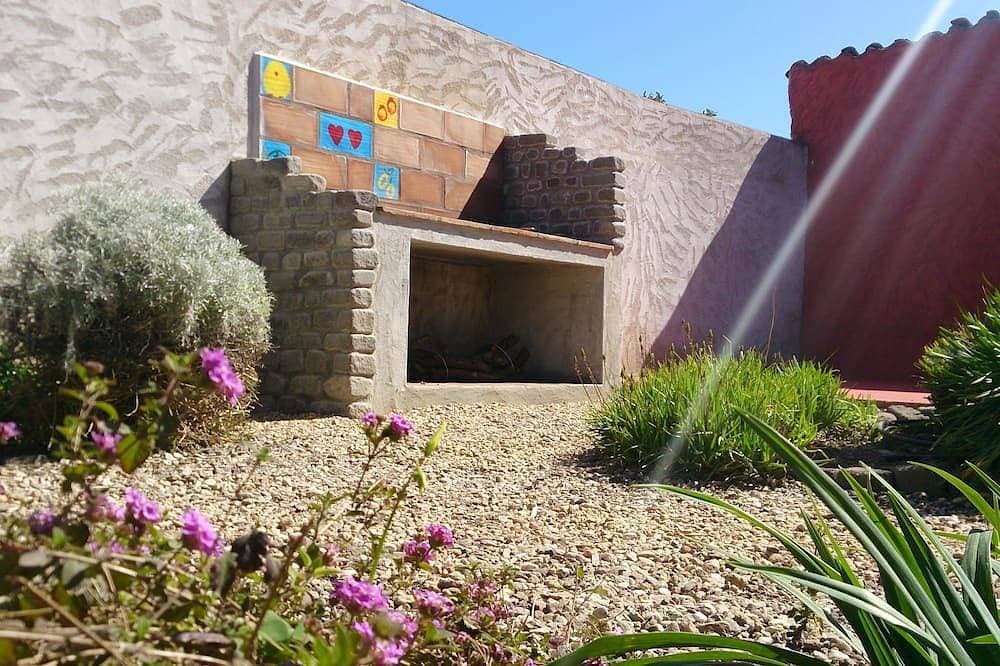 Foto 11 von 27: Charming house with beautiful garden, close to the beach. Free WiFi!